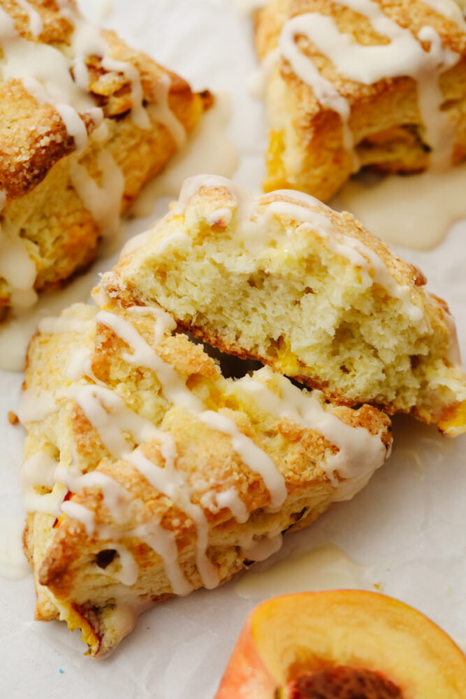 A scone broken in half so you can see the fluffy inside. 