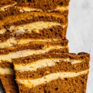 Slices of pumpkin bread with cream cheese swirls.