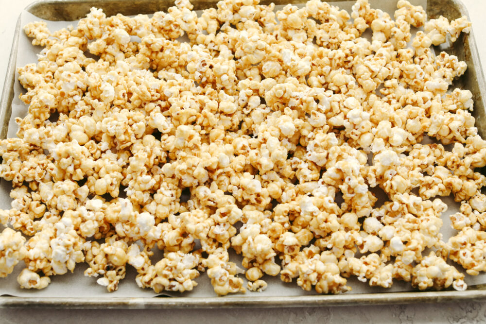 Caramel corn on a cookie sheet. 