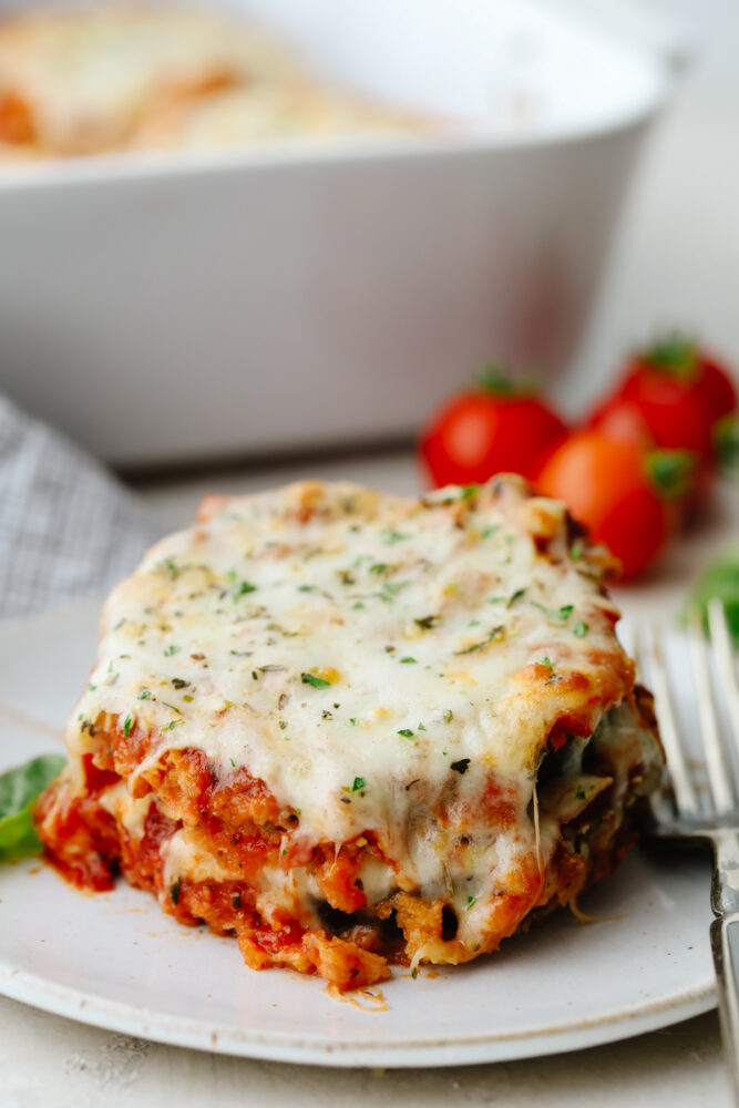 A slice of eggplant parmesan on a plate. 