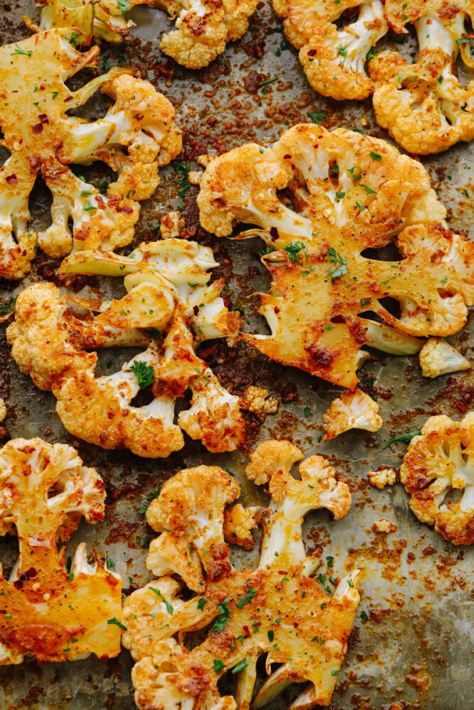 Roasted cauliflower on a baking sheet.