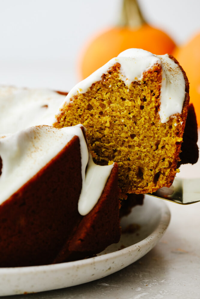 Pumpkin slice being pulled out of the cake. 