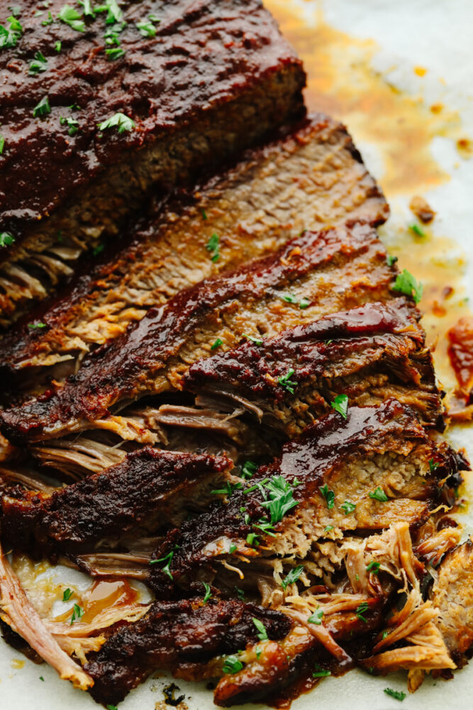 A zoomed in picture of a sliced slow cooker beef brisket. 