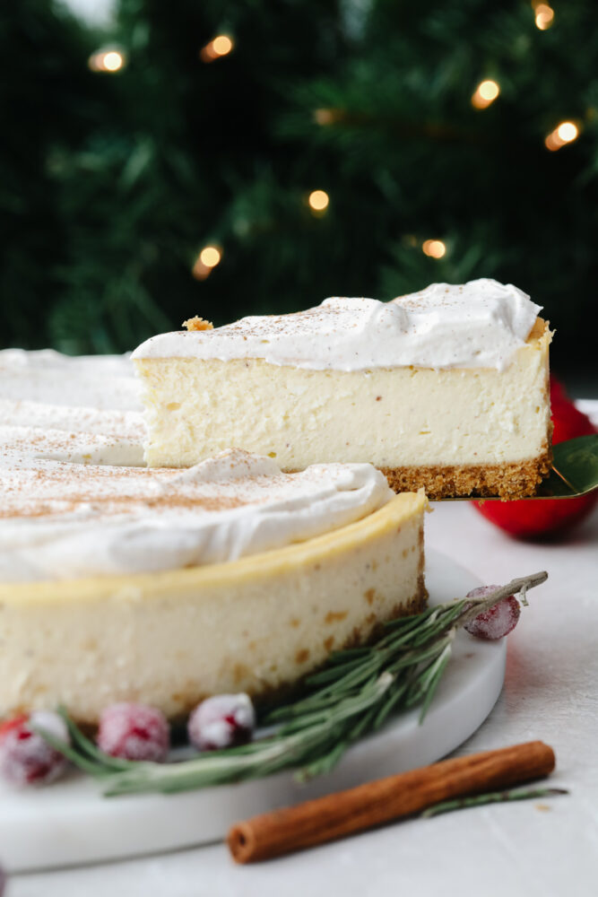 A slice of cheesecake being taken out. 