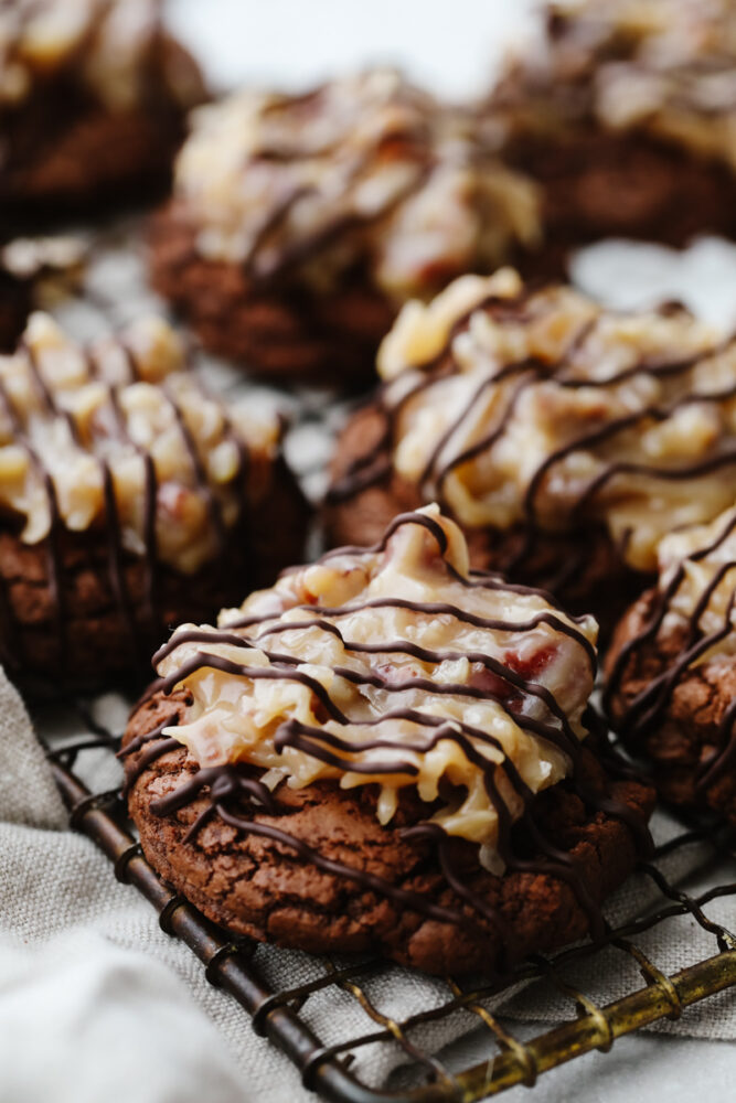 A zoomed in shot of German chocolate cookies on a cooling rack. 