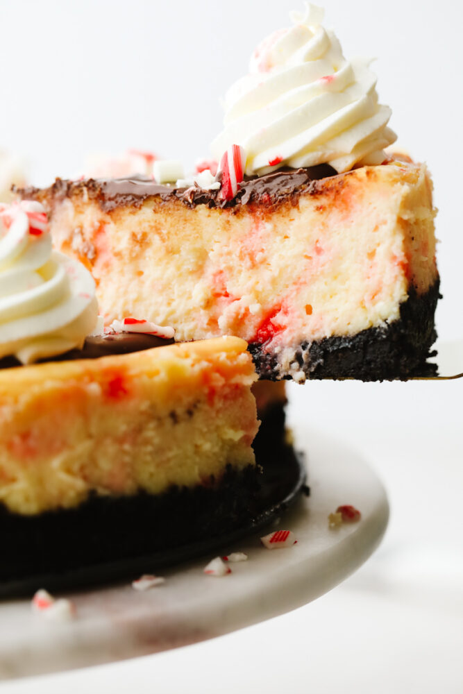 Side view of a slice of peppermint cheesecake.