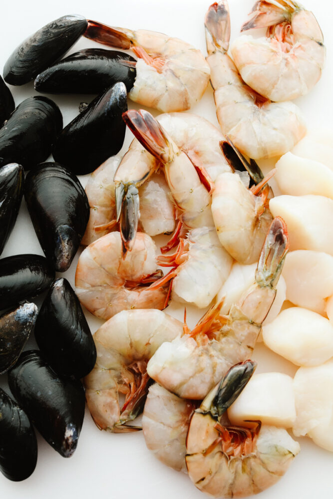 Mussels, shrimp and scallops cleaned and ready to cook. 