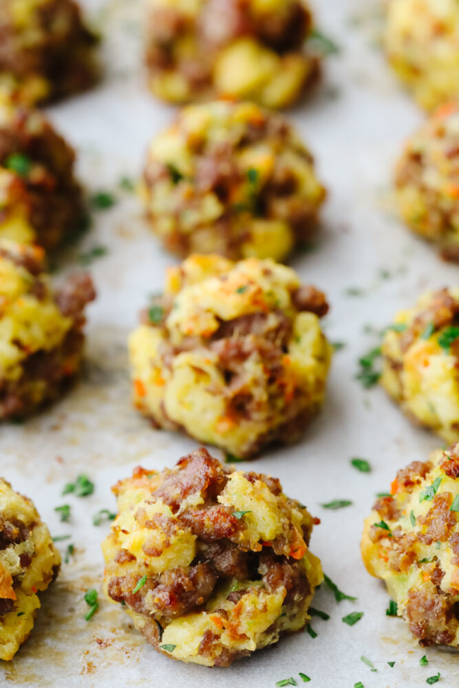 Sausage stuffing balls on a baking sheet ready to eat. 