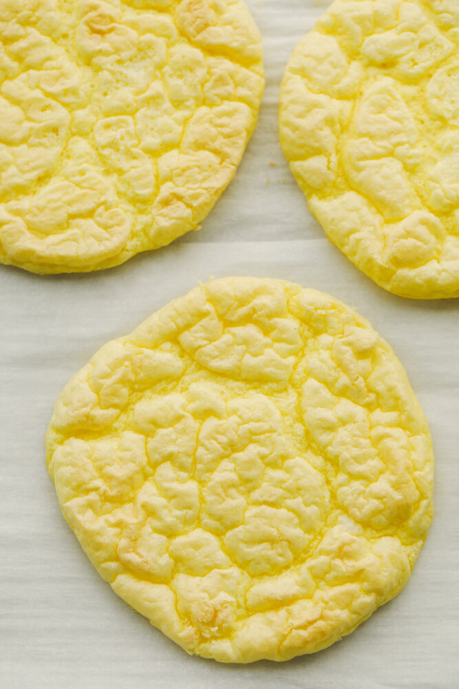 Baked cloud bread on parchment paper. 