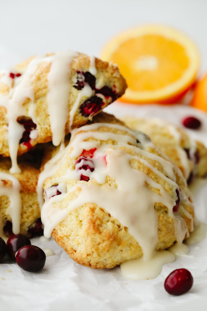 A cranberry orange scone with a glaze on top. 