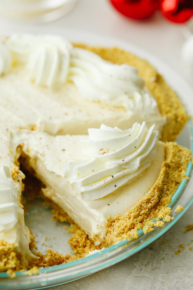 Eggnog pie cut in the pie pan. 