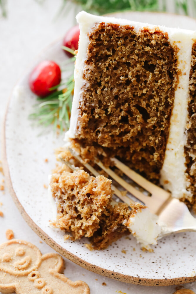 Closeup of cake slice and breaking off a piece with a fork.