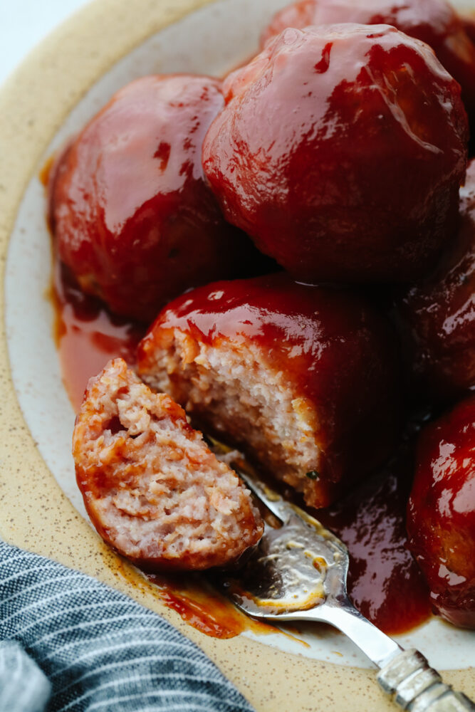 Closeup of a ham ball being cut in half.