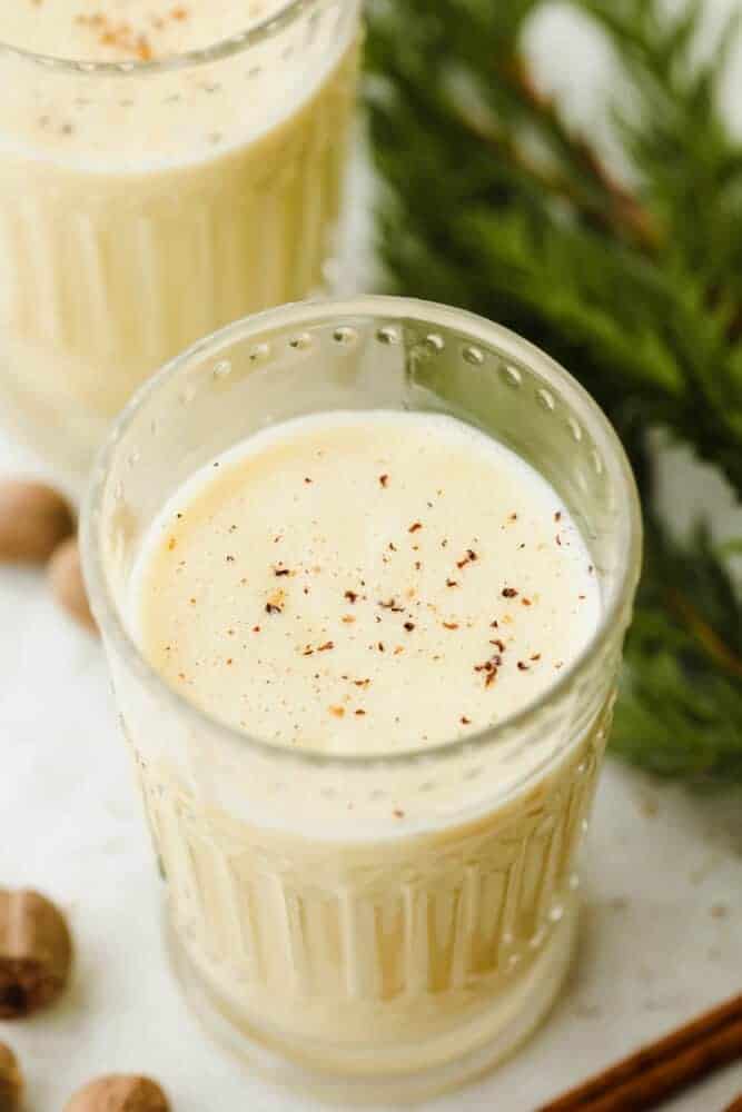 Eggnog in a glass garnished with nutmeg.