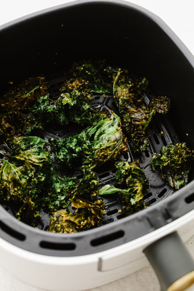 Kale chips in an air fryer.