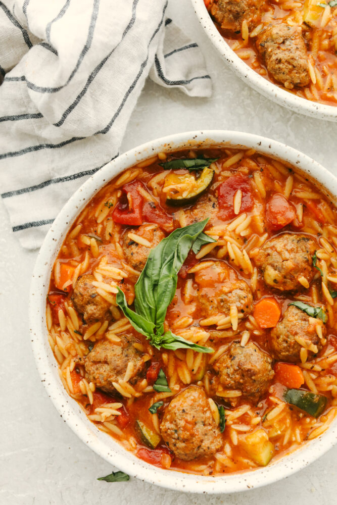 Meatball soup in a white bowl. 