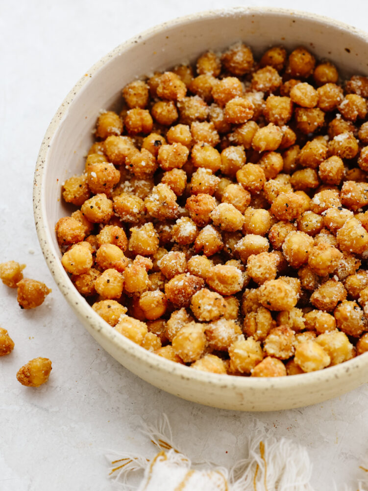 A bowl of roasted, seasoned chickpeas. 