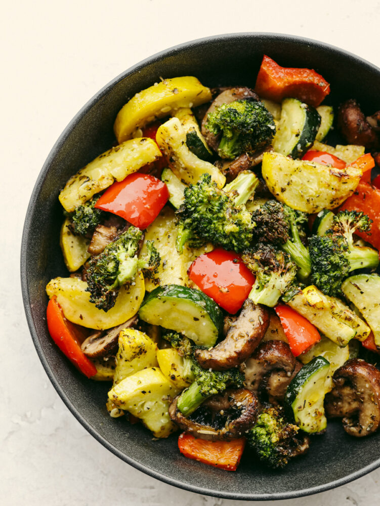 Cooked air fryer vegetables in a dish. 