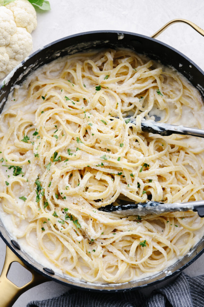 A saucepan of fettucine alfredo. 