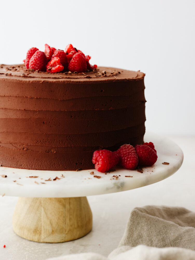 Chocolate mousse cake on a cake pedestal. 