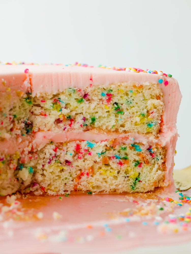 A side view of a slice of funfetti cake.