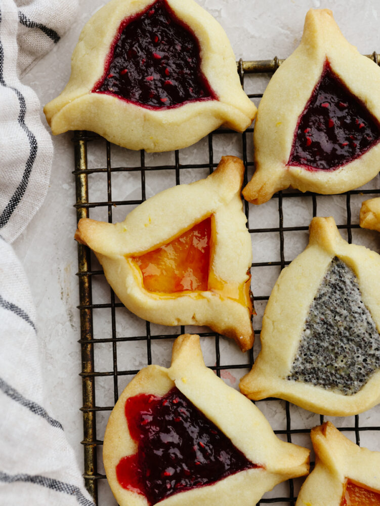 Hamantaschen on a cooling rack. 