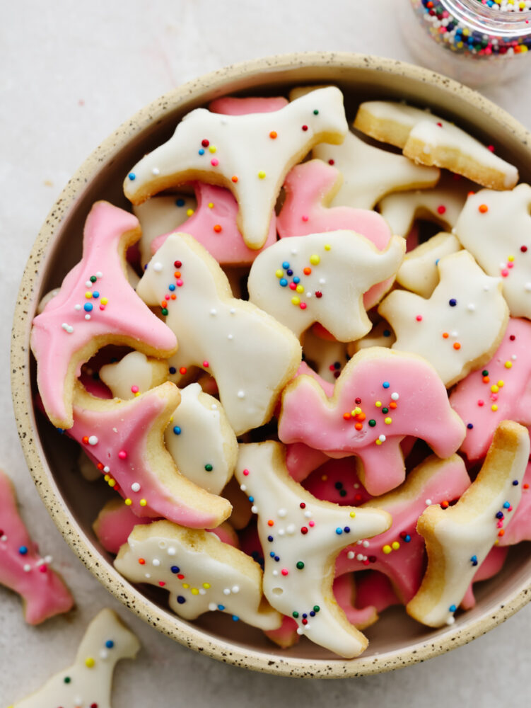 A gray, speckled bowl filled with circus animal cookies. 