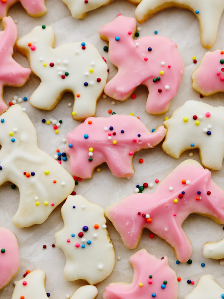 Circus animal cookies decorated and on some parchment paper. 