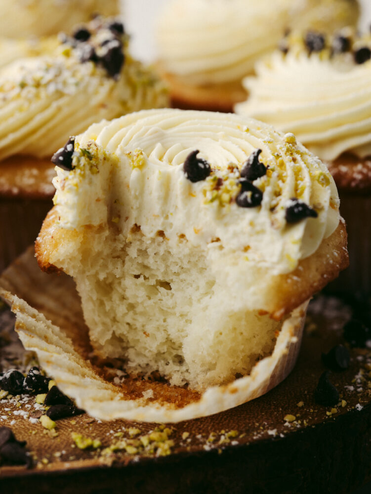 Closeup of cannoli cupcake cut in half.