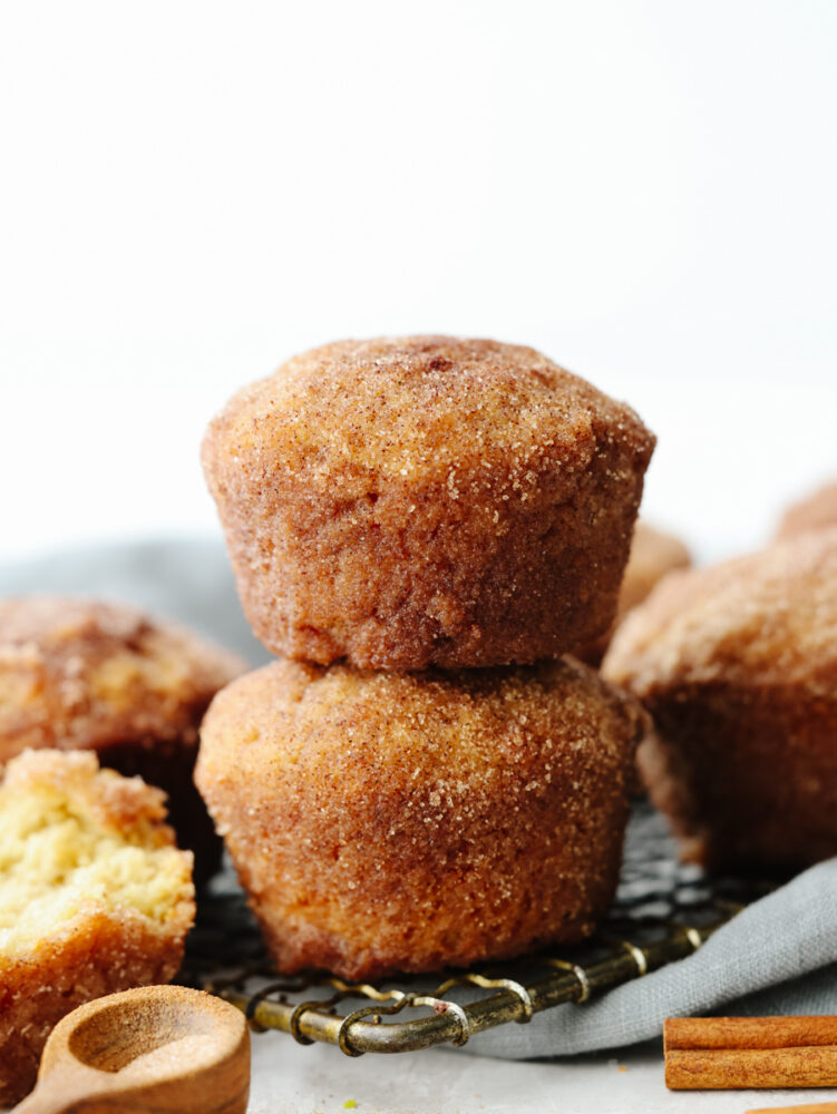 A stack of 2 donut muffins on a cooling rack. 