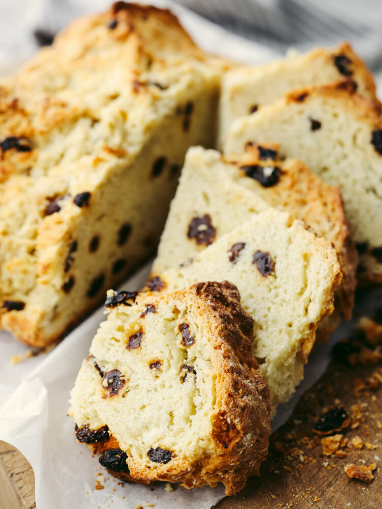 A loaf of soda bread sliced and ready to eat. 