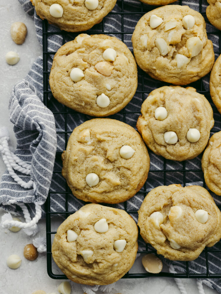 The top view of macadamia nut cookies on a cooling rack. 