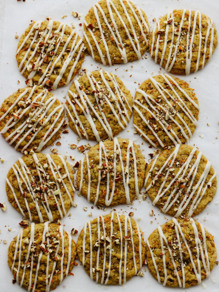 Top-down view of 12 cookies on parchment paper.