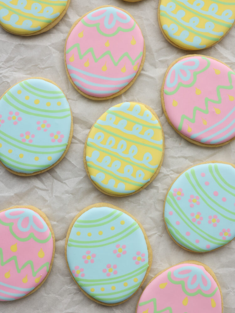 Closeup of decorated cookies on parchment paper.