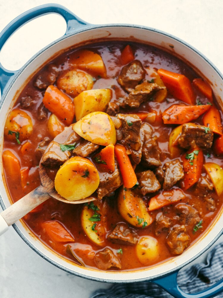 Guinness stew in a blue skillet.