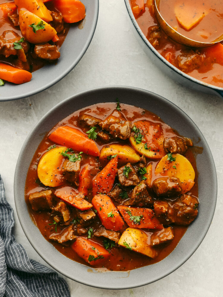 Irish Guinness Stew in a gray stoneware bowl.