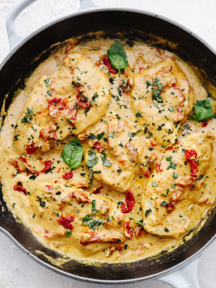 A skillet with marry me chicken cooked and ready to eat. 