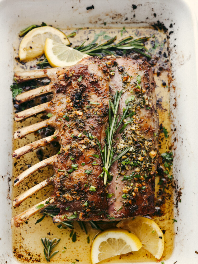 The top view of the rack of lamb in the baking dish, cooked and resting. 