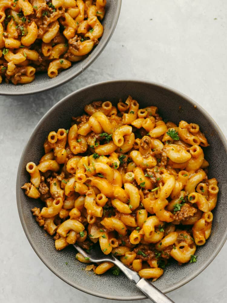 Hamburger helper in a bowl with a silver fork. 