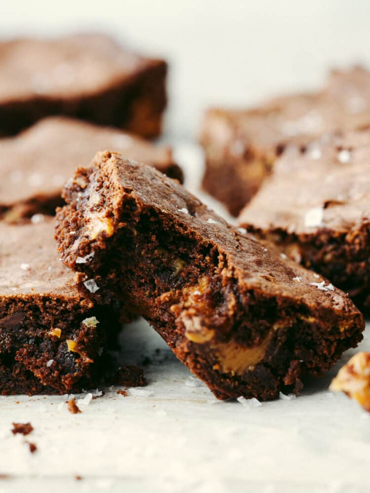 A salted caramel brownie with a bite taken out of it. 