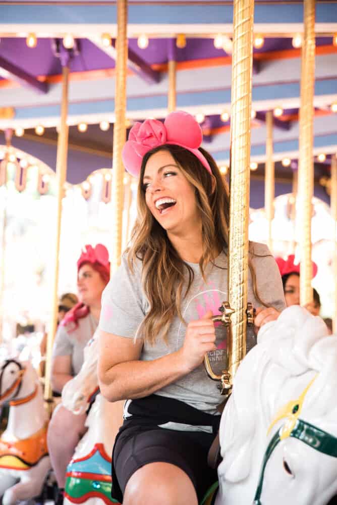 Closeup of a woman on a carousel.