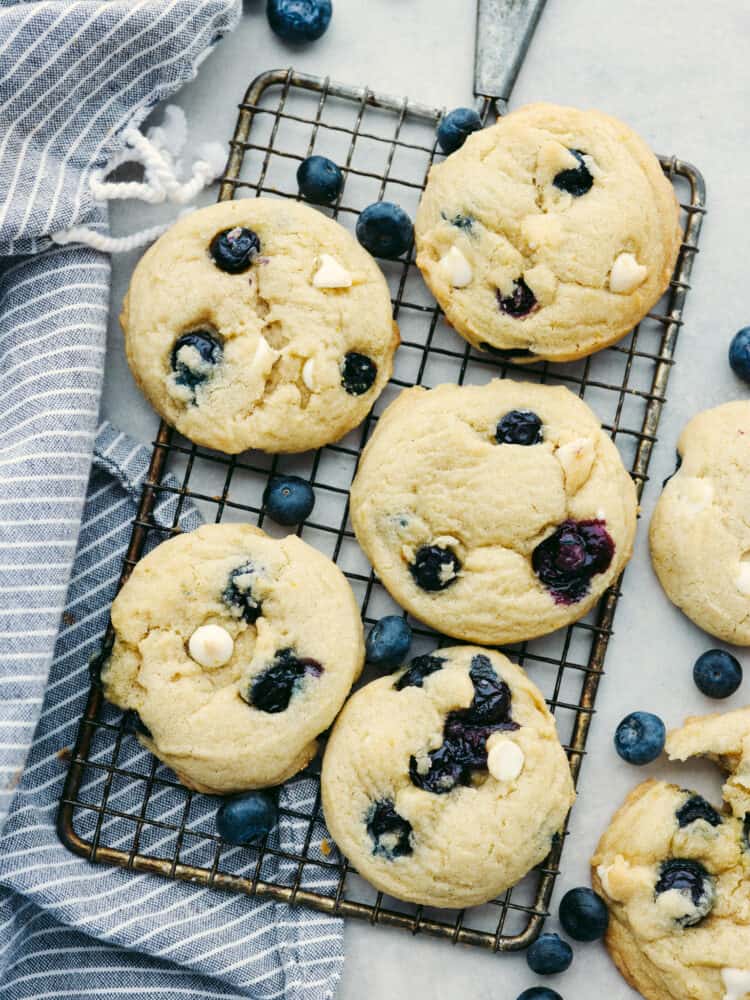 Top-down view of 5 cookies on a cooling rack.