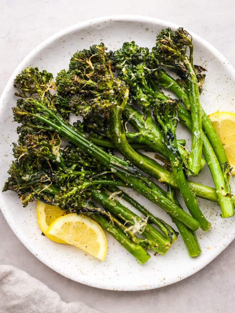 A plate of cooked broccolini, ready to eat. 