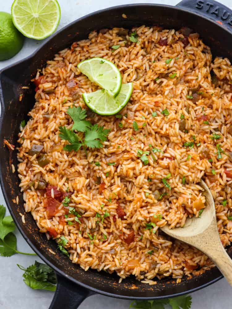 The top view of a pan full of cooked Mexican rice. 