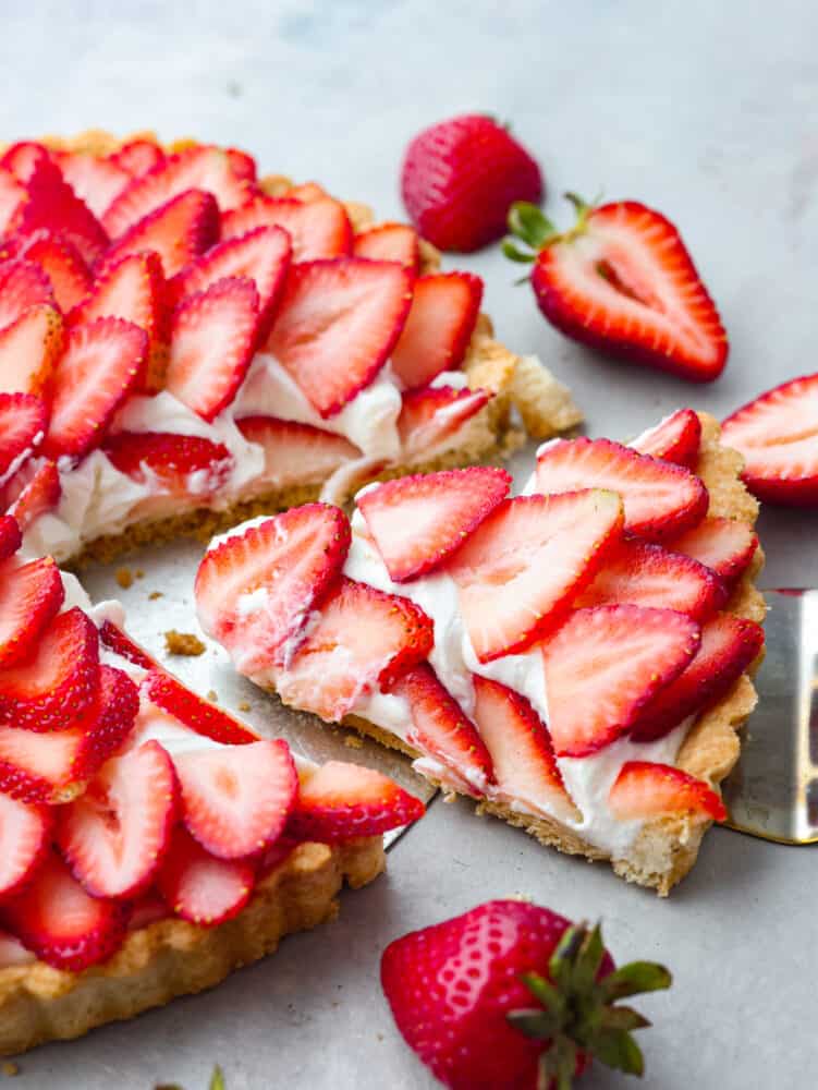 A slice of tart being served with a cake spatula.