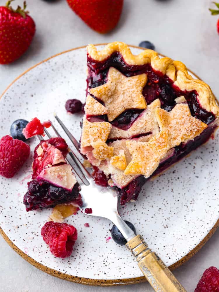 Closeup of a slice of pie with a bite taken out of it.