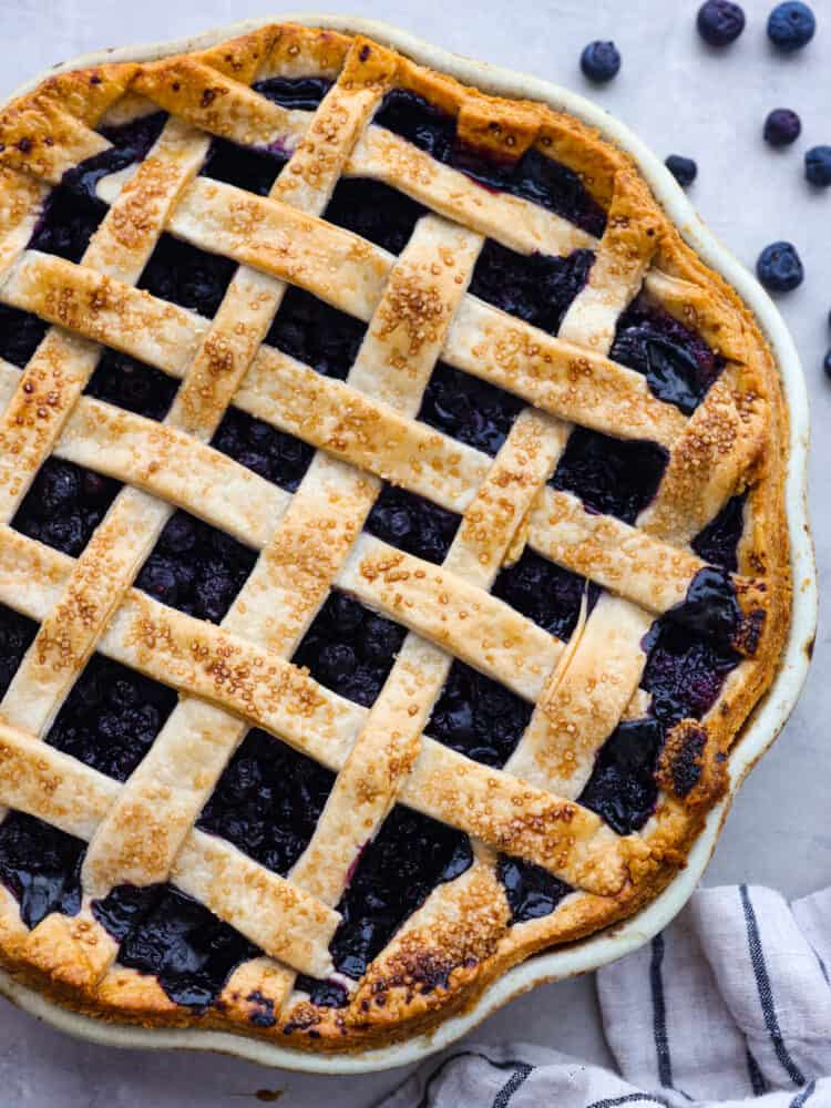 The topview of a blueberry lattice pie. 