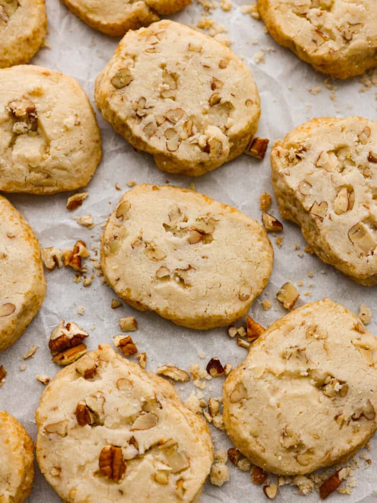 The top view of baked cookies on parchment paper. 