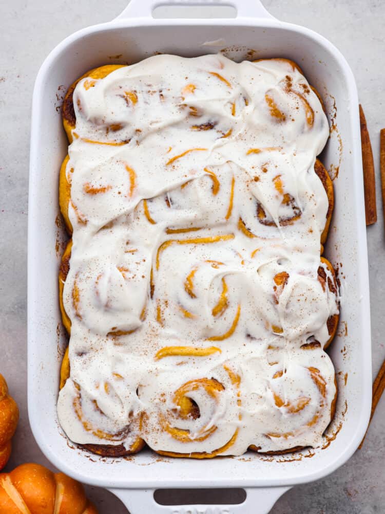 Top-down view of an entire pan of pumpkin cinnamon rolls.