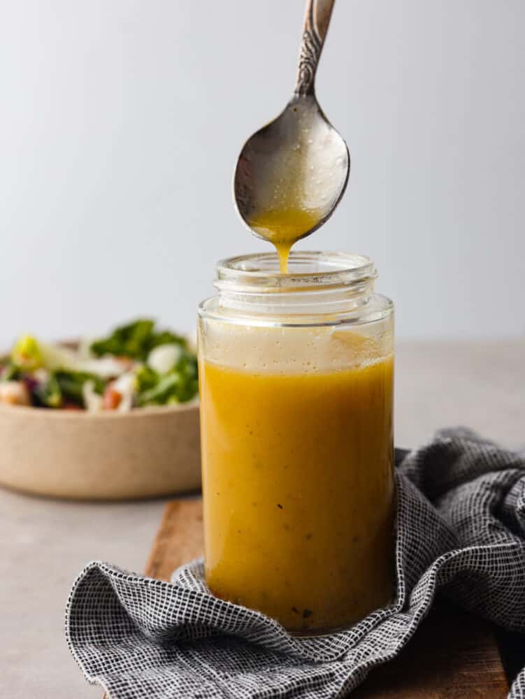 Apple cider vinaigrette in a glass jar.